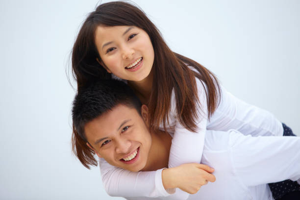 istock happy young Chinese couple together 164962097