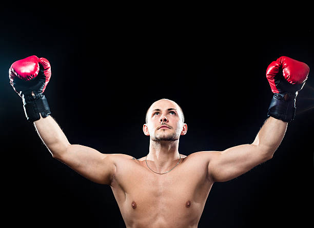 istock Muscular boxer in victory gesture 164962151