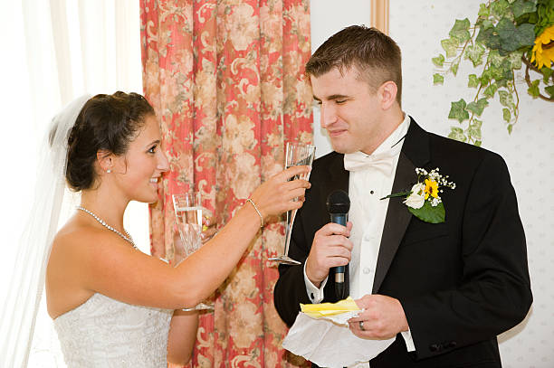 istock Bride Holds Champaign Flute for Groom Giving Toast 164962969