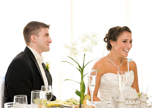 istock Cheerful Bride and Groom at Wedding Reception Head Table 164962971