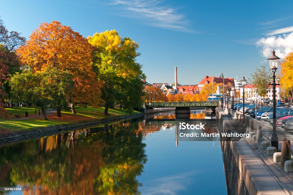 Autumn trees reflecting on river in Rosenlundskanalen Gothenburg city canal Gothenburg Stock Photo