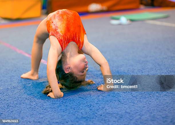 Toddler Girl In Leotard Doing A Bridge Stock Photo - Download Image Now - Gymnastics, Child, Girls