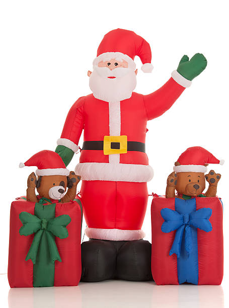 Inflatable Santa Clause Lawn Decoration (Isolated) Large, inflatable Santa Clause yard ornament captured in studio, isolated on white background. garden feature stock pictures, royalty-free photos & images