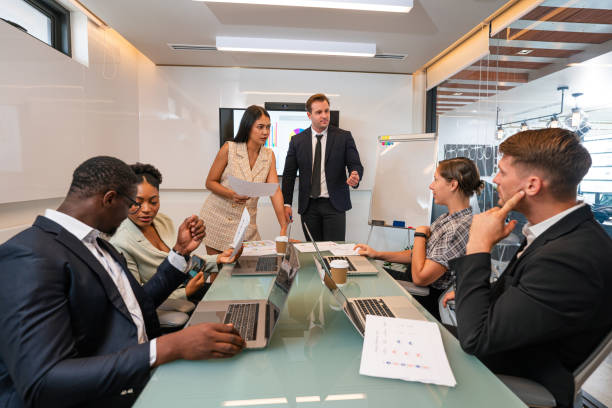 istock Group of professional business people are working and shaking hands while working in the creative office. 1649688117