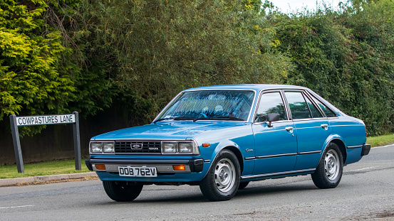 Whittlebury,Northants,UK -Aug 27th 2023: 1979 blue Toyota Corolla   car travelling on an English country road