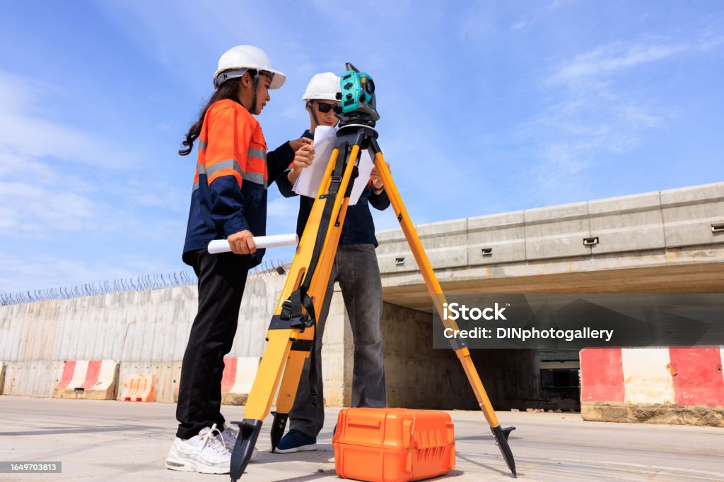 Route Engineer Engineer Use Theodolite Equipment And Looking Blueprints Construction ...