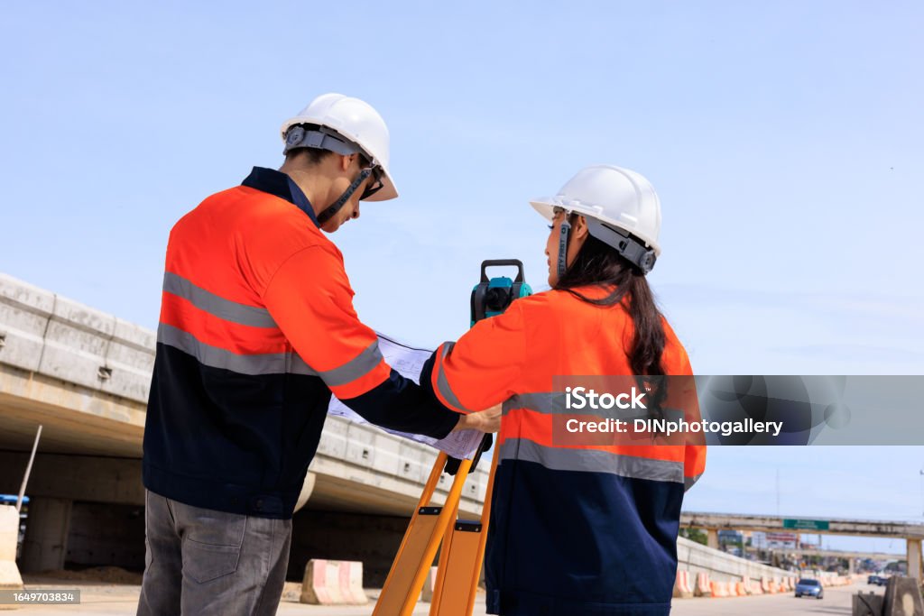 Route Engineer Engineer Use Theodolite Equipment And Looking Blueprints Construction ...