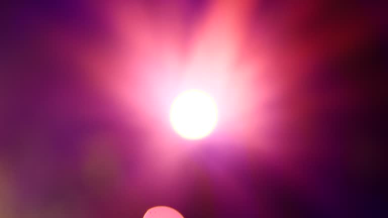 Pink purple Bokeh abstract blurred background festive traffic red lights car on road sparkling circular animate motion 3D. Backdrop with twinkling bright shape blinking lights in modern city