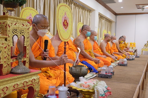 Bangkok, THAILAND - AUGUST 15: Many monks are chanting prayers at the auspicious ceremony.