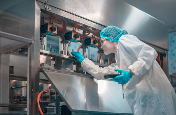 istock Water production team uses barcode scanners to ensure accurate bottle arrangement under guidance 1649750769