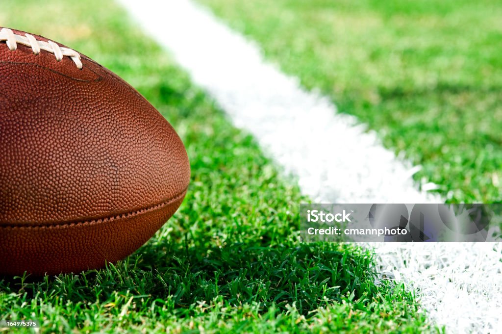 First and goal, ball at goal line - American Football American Football - First and goal - Close up of football inches from the goal line American Football - Ball Stock Photo