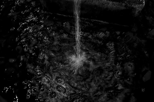 Water fountain in motion blur and black and white