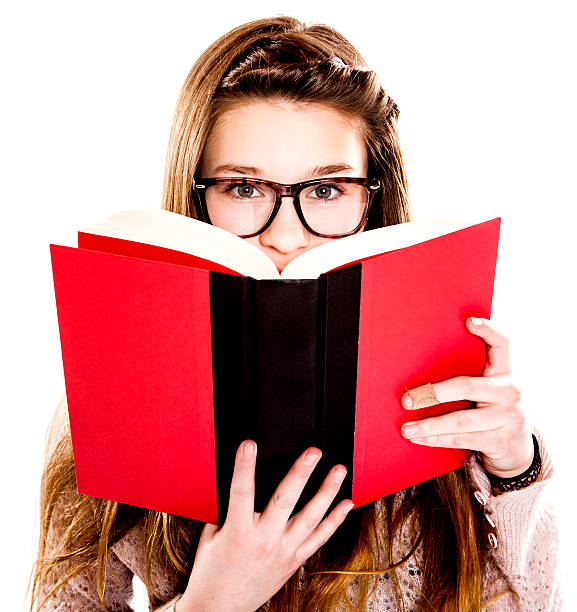 istock Cute Teenage Girl Reading a Book 164981059