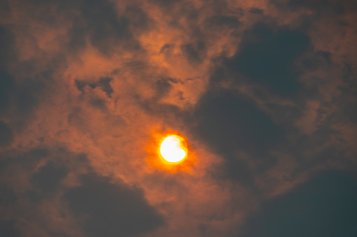 Sun viewed through clouds and smoke