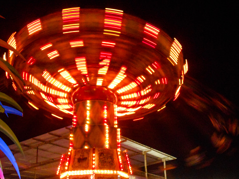 long exposure of a swing ride at night