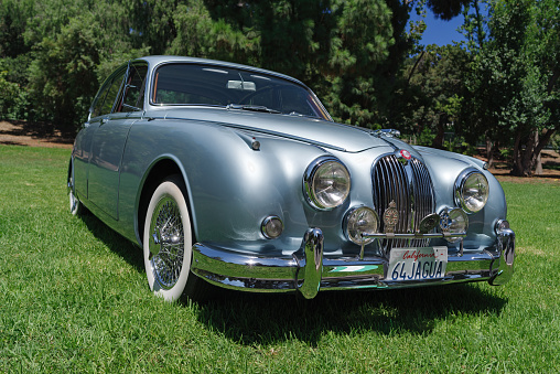 San Marino, California, United States - August 27, 2023: 1960s Jaguar MK2 shown parked on grass at Lacey Park.