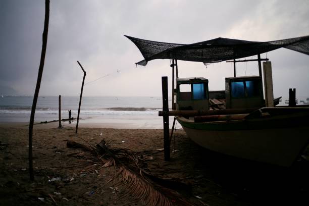 Boat parking on dirty sandy beach