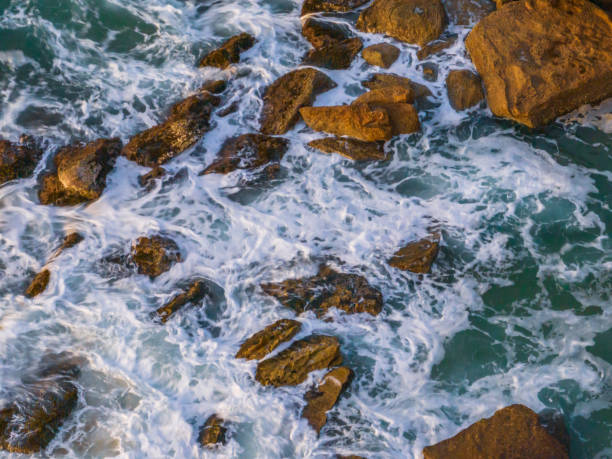 istock Surf, sea, sand, rocks, sunrise at the beach 1649997227
