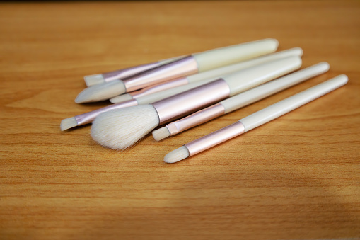 set of various brushes for makeup on table