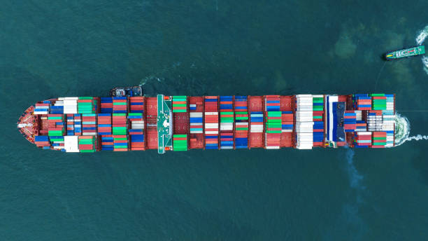 istock Aerial top view of cargo container ship carrying container from custom container depot go to ocean concept freight shipping by ship service on blue sky .Freight Forwarding Service 1650023113