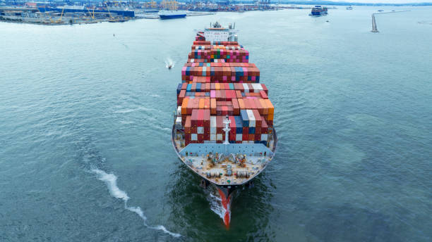 istock Aerial side view of cargo container ship carrying container from custom container depot go to ocean concept freight shipping by ship service on blue sky .Freight Forwarding Service 1650023637