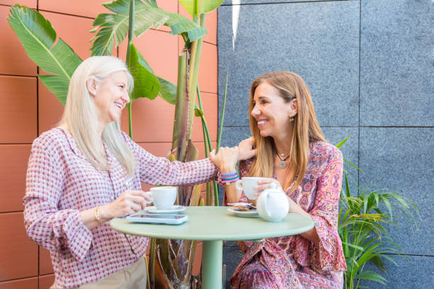 istock Friends drinking coffee together on a colorful terrace 1650090254