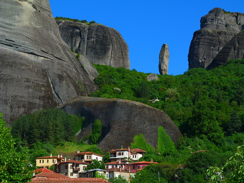 The rocky escarpments of Meteora with the village of Kastraki in the foreground, Thessaly, Greece