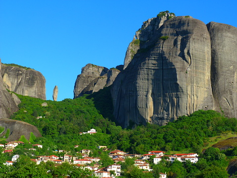 The rocky escarpments of Meteora with the village of Kastraki in the foreground, Thessaly, Greece