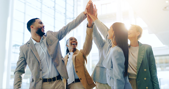 Business people, high five and teamwork, support or collaboration with goals, success and celebration. Circle, internship motivation and happy group of men and women with hands together for mission