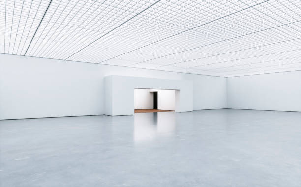 istock Side view of an empty white large gallery/showroom interior with ceiling industrial construction and an illuminated central niche 1650133399