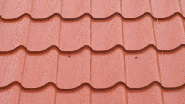 istock Rain Hitting Modern House Roof Tiles during Thunderstorm Water Drops Close Up 1650135964