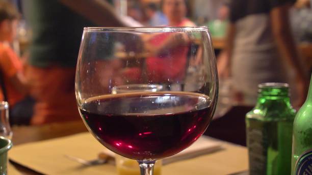 istock Drinking Red Wine in the Restaurant in the Evening with Background People Bokeh 1650138697