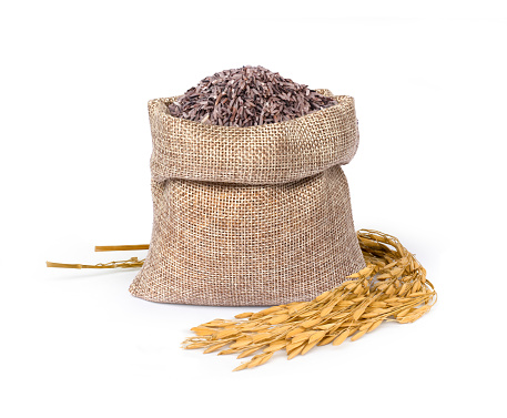 Black rice in sack bag  isolated on white background.