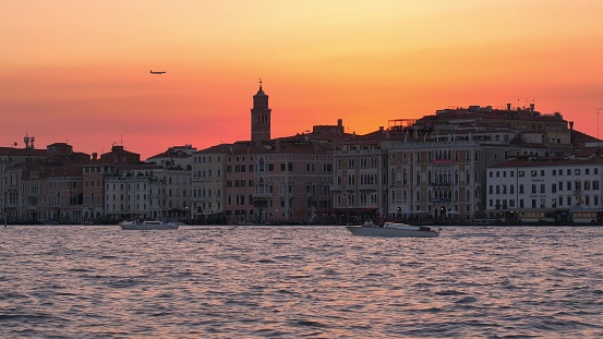 Venice Italy Landscape with Aircraft and Boats at Sunset from Grand Canal