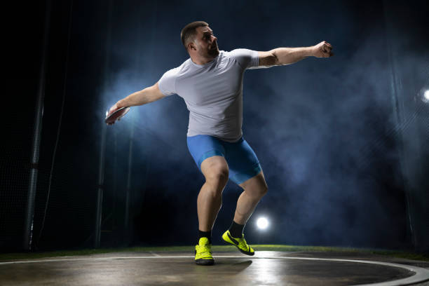 istock Male athlete holding discuss 1650168406