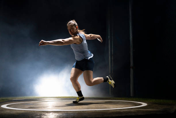 istock Female athlete turning with discus 1650168412