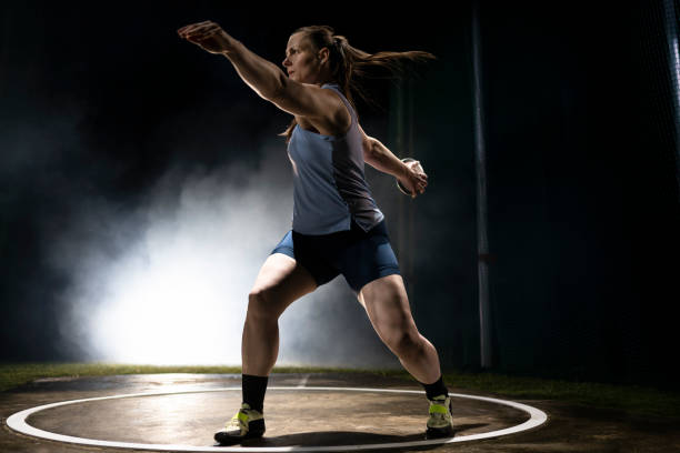 istock Female athlete turning with discus 1650168440