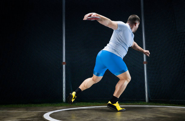 istock Male athlete holding discuss 1650168450