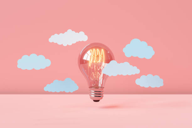 istock Incandescence lighted bulb with cloud on pink background 1650168563