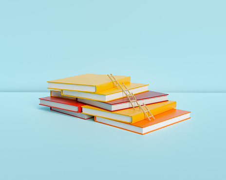 Stack of books on bright blue background