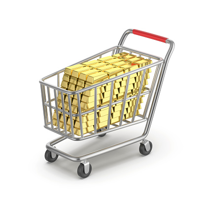 Shopping cart with many gold bars on white background