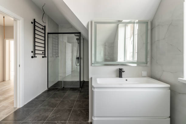 istock Bathroom in a modern house with black ceramic tiles on the floor 1650169340