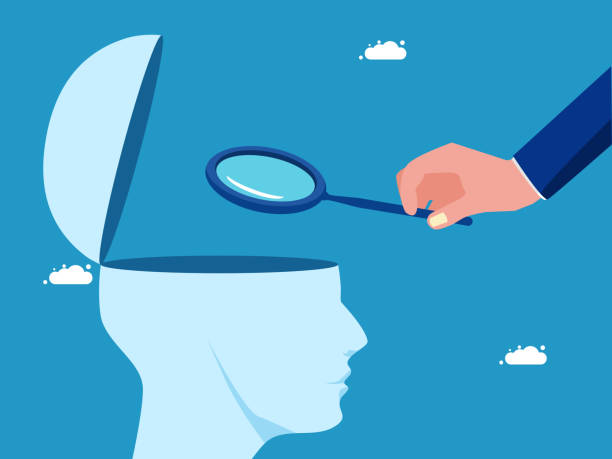istock Brain analysis. Businessman uses a magnifying glass to look at the human head 1650178380