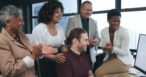 istock Clapping, high five and business people on computer bonus, startup goals, profit or project celebration in office. Happy group of men and women with teamwork, success or support for winning on laptop 1650181248