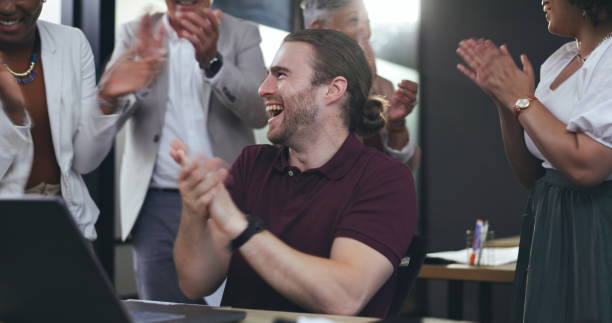 istock Clapping, high five and business man on computer for bonus, startup goals and profit or project celebration in office. Happy group of people with teamwork, success and support, wow or news on laptop 1650189812