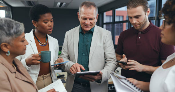 istock Tablet, men and mentor training designer, teamwork and planning in creative startup office. Technology, senior manager and coaching intern employee for graphic project, brainstorming and business 1650190372