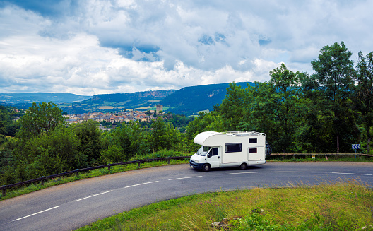 Motorhome on the road in countryside- vacation, road trip,adventure concept- Lozere, Occitanie region in France
