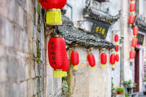 Anhui China July 19, 2021, Red lanterns hang on the narrow streets of the ancient village of Xidi