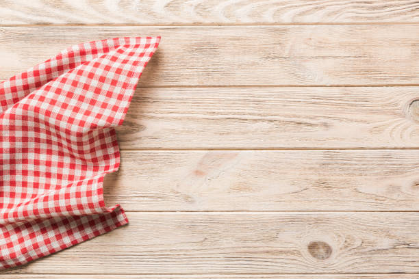 istock top view with red empty kitchen napkin isolated on table background. Folded cloth for mockup with copy space, Flat lay. Minimal style 1650221546