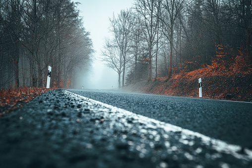 Glasgow, Scotland - Poor visibility at night during winter fog as Crow Road in Glasgow's West End is busy with traffic.